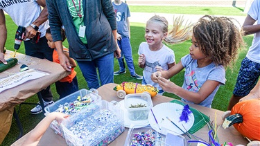 Kids decorate vegetable racecars