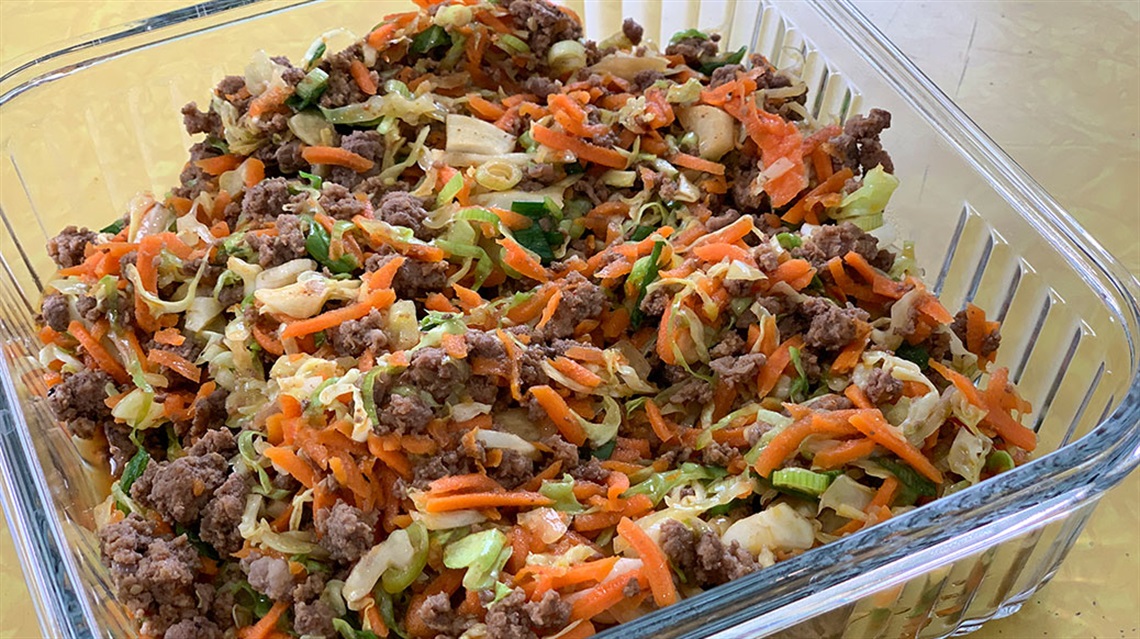 beef and cabbage stir fry in glass dish
