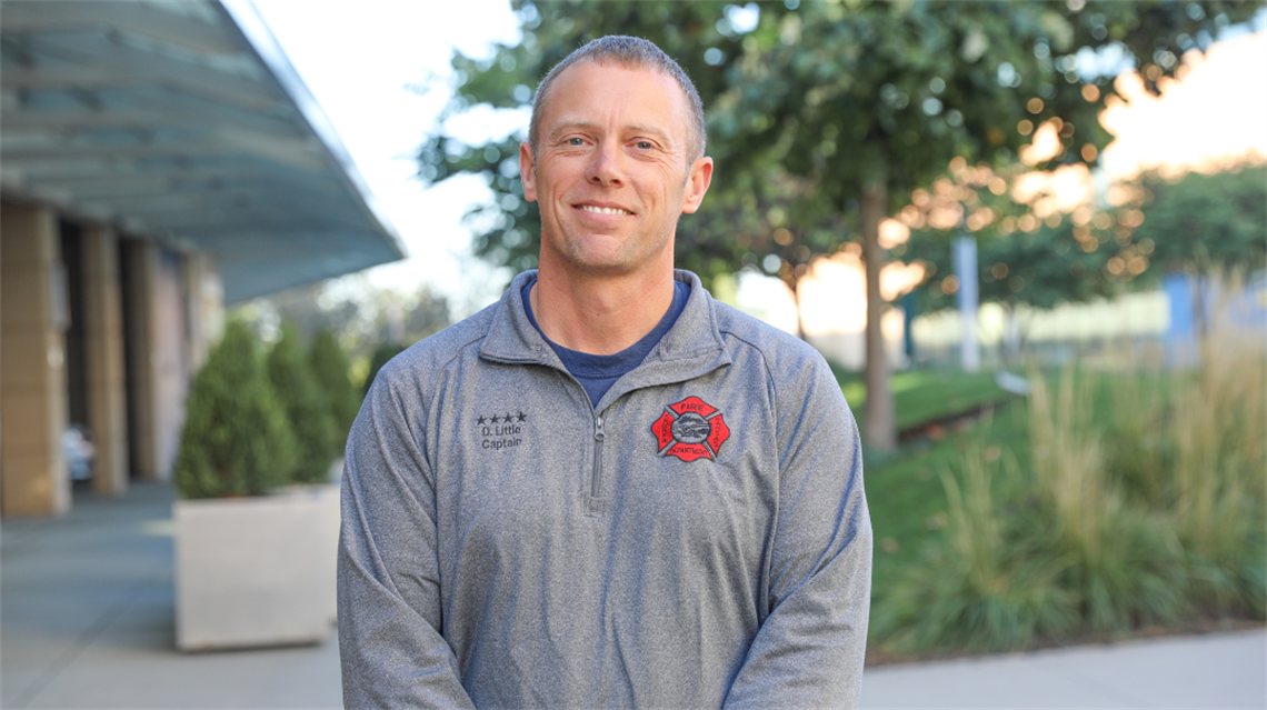 Dave Little smiling outside Lenexa City Hall