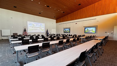 Community Room with chairs and tables set up in rows