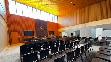 View of courtroom from audience view among chairs