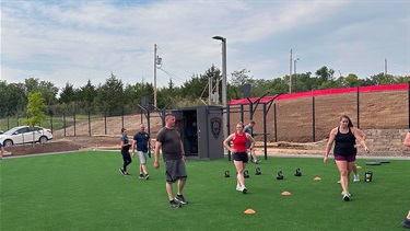 Staff using outdoor wellness and exercise area at Lenexa Justice Center