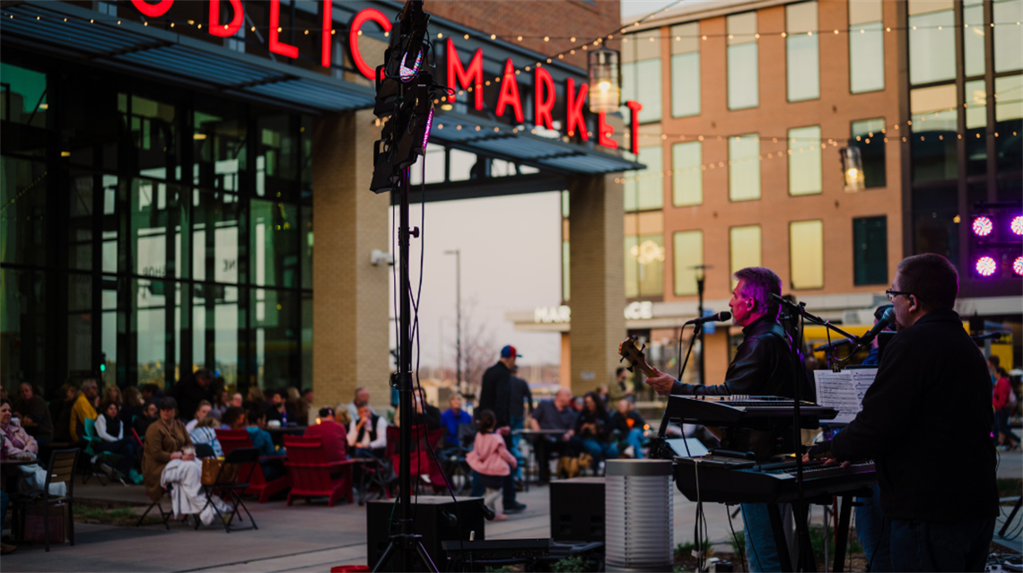 Band playing outside the Lenexa Public Market for Friday Night Sound Bites