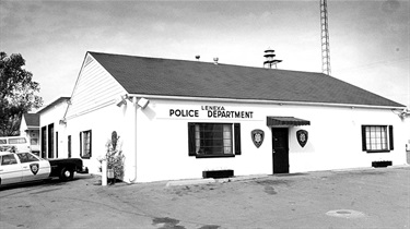 Exterior of Lenexa Police Department and patrol car (circa 1970s)