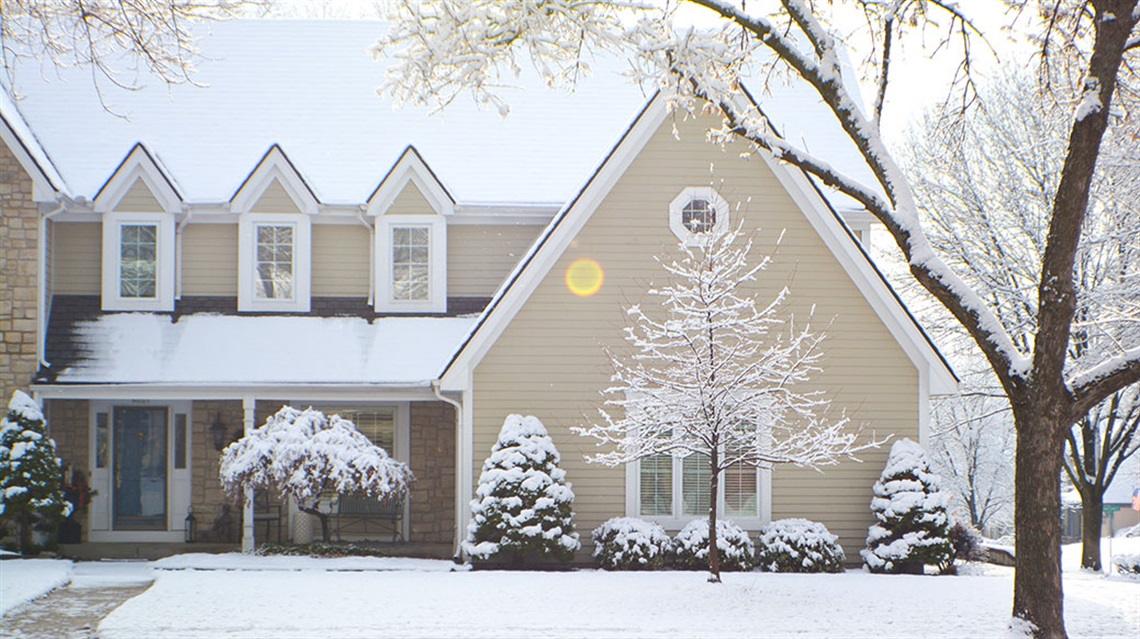 Front view of two-story house after snowfall